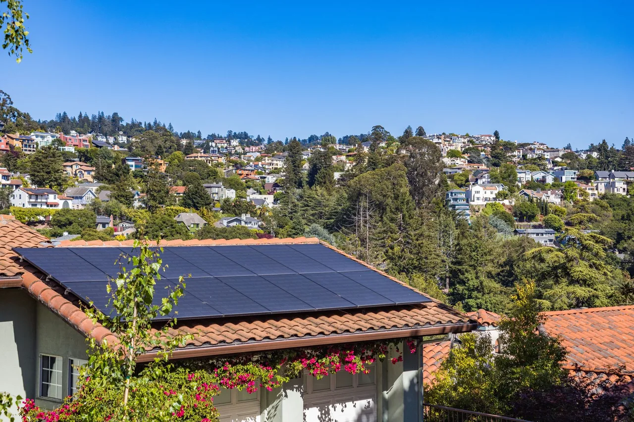 Solar panels arranged on a rooftop in daylight